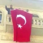 Police detain Kurdish mayor, hang Turkish flag on facade of town hall