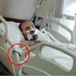 Photographs reveal former officer handcuffed to hospital bed while intubated for COVID-19