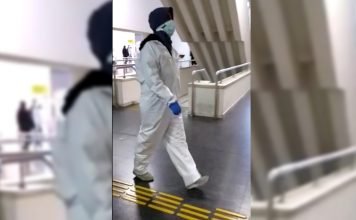 Turkish woman with COVID-19 made to appear before judge in hazmat suit