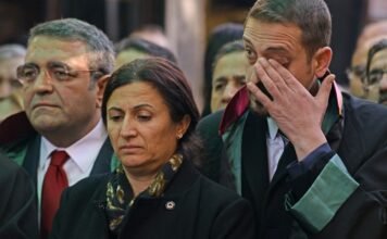 Cafe owned by wife of slain Kurdish lawyer targeted with stun grenades, gunfire